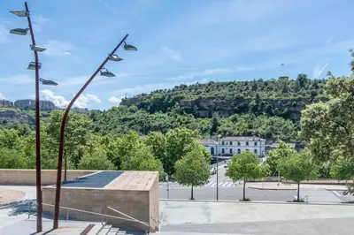 a group of lights on a pole in a parking lot at Kisa Apartments de Manresa in Manresa