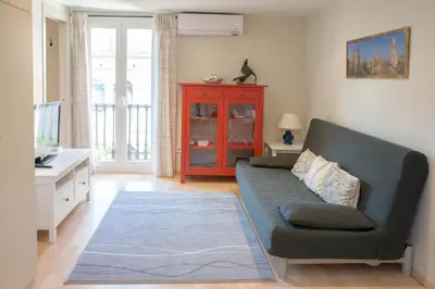 a living room with a couch and a table at Barcelona4Seasons - Gavina in Barcelona