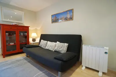 a living room with a couch and a cabinet at Barcelona4Seasons - Gavina in Barcelona