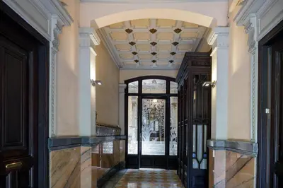 an ornate hallway with a door and a ceiling at Enjoy Apartments Gran Via in Barcelona