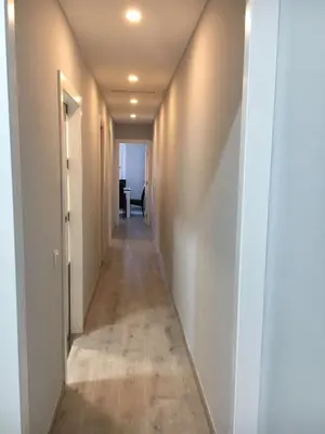 a hallway with a long corridor with white walls at sagrada familia gaudi in Barcelona