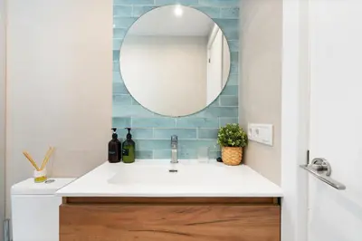 a bathroom with a sink and a mirror at Lodging Apartments Beach Studio 41 in Barcelona