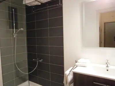 a bathroom with a shower and a sink at Marbel Apartments in Barcelona
