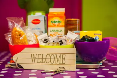 a table with a box of food and a pair of keys at Estudio Maignon in Barcelona