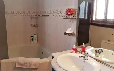 a bathroom with a sink and a bath tub at Apartamento Mediterraneo in Pineda de Mar