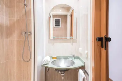 a bathroom with a sink and a shower at Homenfun Barcelona Gracia in Barcelona