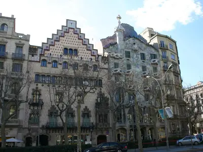 a large building with trees in front of it at Mirall Sant Gervasi in Barcelona