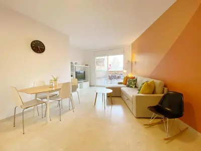 a living room with a couch and a table at Terracotta terrace in Barcelona