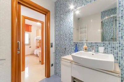 a bathroom with a sink and a mirror at Fragata Sitges Rentals in Sitges