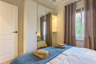 a bedroom with a bed with two towels on it at Moreryadom in Barcelona