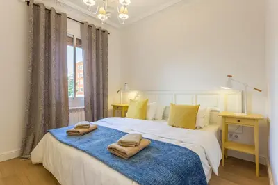 a bedroom with a bed with two towels on it at Moreryadom in Barcelona