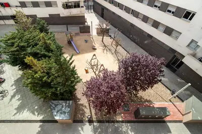 an overhead view of a courtyard with trees and a building at Stay U-nique Apartments Diagonal II in Barcelona