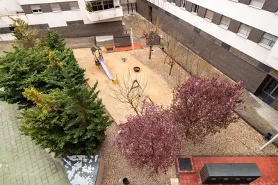 an overhead view of a courtyard with trees and a playground at Stay U-nique Apartments Diagonal II in Barcelona