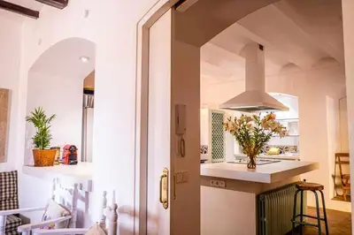 a kitchen with a sink and a stove top oven at Lidia's Rural House (HUTB-0615) in Barcelona