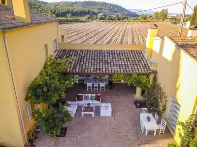 an overhead view of a patio with tables and chairs at Lidia's Rural House (HUTB-0615) in Barcelona