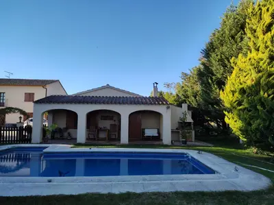 a house with a swimming pool in the yard at Apartment with private pool and garden in San Martín Sarroca