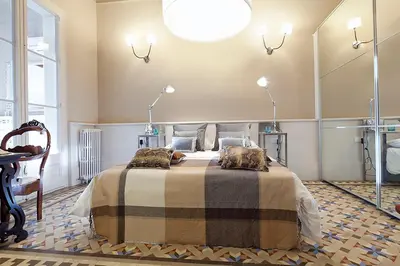 a bedroom with a bed with two pillows on it at My Space Barcelona Rambla Catalunya Center in Barcelona