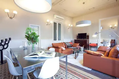 a living room with a table and a couch at My Space Barcelona Rambla Catalunya Center in Barcelona