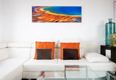 a living room with a white couch with orange pillows at Stay U-nique Apartments Taulat in Barcelona