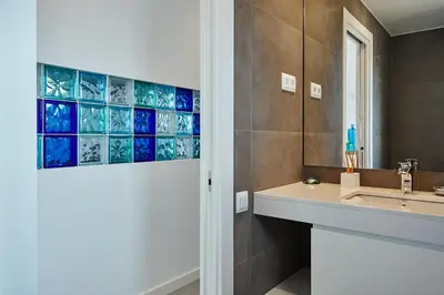 a bathroom with a sink and a mirror at Stay U-nique Apartments Taulat in Barcelona