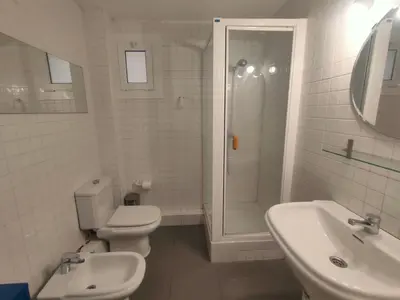 a bathroom with a toilet and a shower and a sink at Esparteria 1 in Barcelona