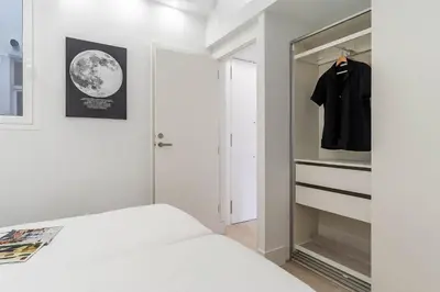 a bedroom with a bed and a walk in closet at 236 - AB Poble Sec Montjuic in Barcelona