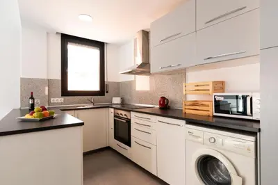 a bedroom with a bed and a window at AB Plaça de Sants in Barcelona