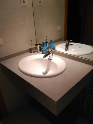 a bathroom counter with a white sink and a mirror at 2 BEDROOMS and 2 BATHROOMS FOR 5 PAX, SWIMMING POOL, FREE PARKING and NEAR THE BEACH! in Sant Adria de Besos