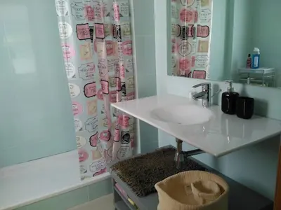 a bathroom with a sink and a shower curtain at 2 BEDROOMS and 2 BATHROOMS FOR 5 PAX, SWIMMING POOL, FREE PARKING and NEAR THE BEACH! in Sant Adria de Besos