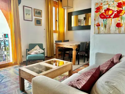 a living room with a couch and a table at Barceloneta Ramblas Apartments in Barcelona