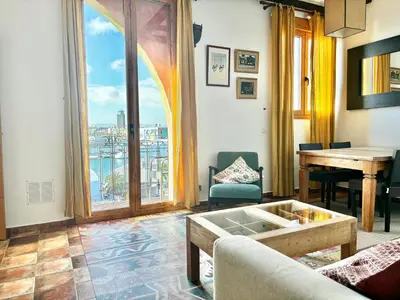 a living room with a couch and a table at Barceloneta Ramblas Apartments in Barcelona