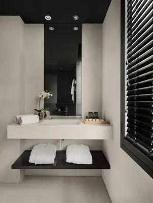 a bathroom with a sink and a mirror at Hotel Casa Sagnier in Barcelona