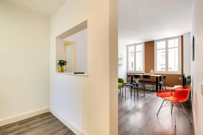 a living room with red chairs and a table at Colorful With Cozy Terrace In Gracia in Barcelona
