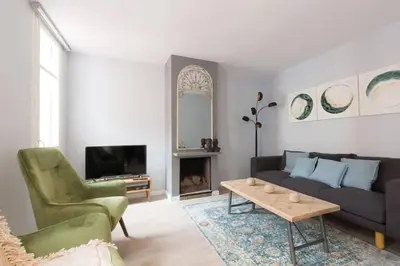 a living room with a couch and a table at 2 Bdr Penthouse In Grcia in Barcelona