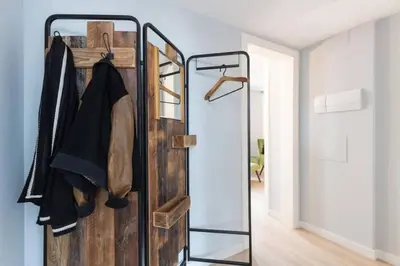 a room with a closet with a glass door at 2 Bdr Penthouse In Grcia in Barcelona