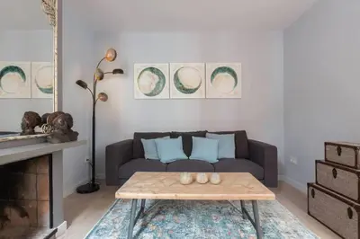 a living room with a couch and a coffee table at 2 Bdr Penthouse In Grcia in Barcelona