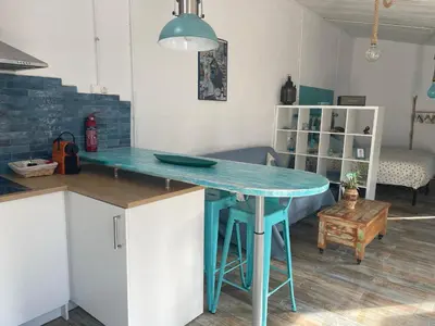 a kitchen with a blue table in a room at Raconet Azul - Circuito Cataluña in Vallromanas