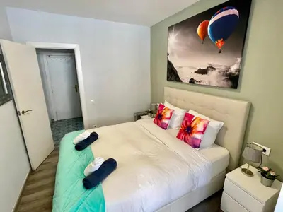 a bedroom with a bed with two slippers on it at Sea Dreams with Amazing Terrace in Sitges