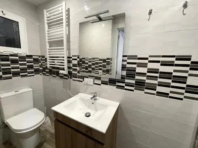 a bathroom with a toilet and a sink at Sant Adria Beach apartment Wi-Fi Parking Free in Sant Adria de Besos