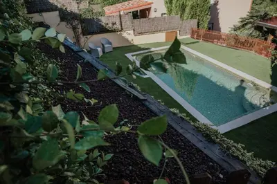 an overhead view of a swimming pool in a yard at Collbato Resort. in Collbató
