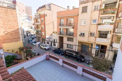 an apartment balcony with a view of a street at Bed&BCN Park Güell in Barcelona