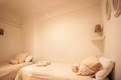 a bedroom with two beds with stuffed animals on them at Apartamento zona Sagrada Familia in Barcelona