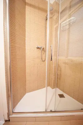 a shower with a glass door in a bathroom at Apartamento zona Sagrada Familia in Barcelona