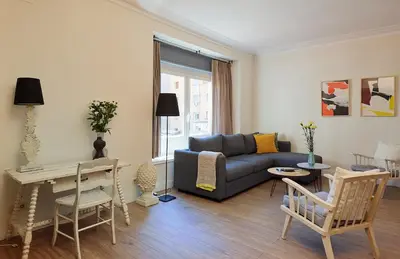 a living room with a couch and a table at Casa Cosi - Casanova 2 in Barcelona