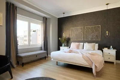 a bedroom with a large bed and a window at Casa Cosi - Terrace 1 in Barcelona