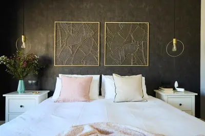 a bedroom with a large white bed with pink pillows at Casa Cosi - Terrace 1 in Barcelona