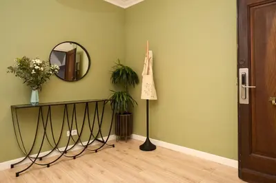 a room with a mirror and a table with plants at Casa Cosi - Casanova 3 in Barcelona