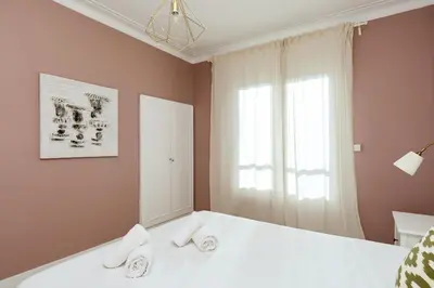 a bedroom with a bed with two towels on it at Casa Cosi - Casanova 6 in Barcelona