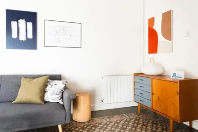 a living room with a couch and a dresser at Casa Cosi - La Gleva 4 in Barcelona