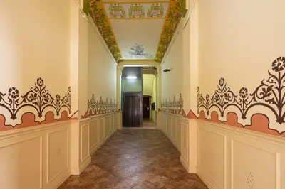a hallway in a building with an ornate ceiling at Casa Cosi - La Gleva 4 in Barcelona